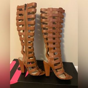 Michael Antonio Gladiator boots, size 6